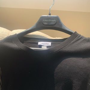 Calvin Klein classic black dress with see-through sleeves.